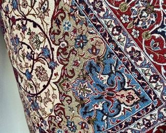 An absolutely stunning Isfahan Persian rug hanging on the wall.  It doesn’t get any nicer!  Signed in Arabic on  the fringe edge.