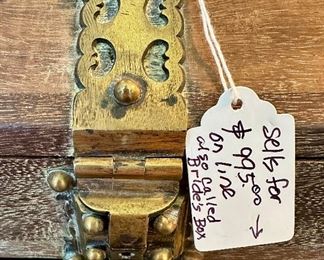 This is a special antique box with brass hardware.