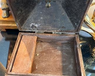 This is a special antique box with brass hardware.
