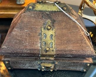 This is a special antique box with brass hardware.