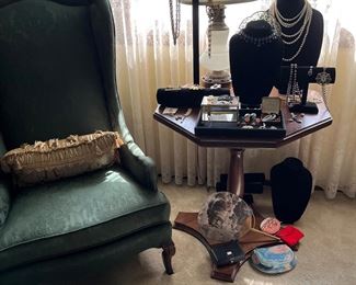 Master Bedroom 
A table full of estate jewelry 
And 
A good low French slipper chair along with a hand made hexagonal table that is holding the jewelry!