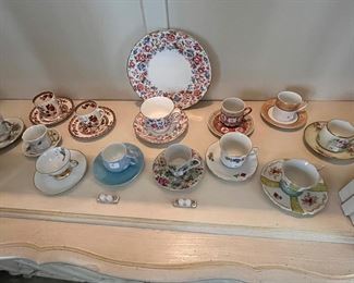 A great section of vintage demitasse cups and saucers, Royal Crown Derby, Dresden, and much more