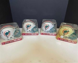 Four Signed Mini Miami Dolphins Helmets