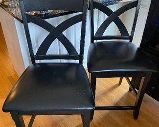 Pair of black low bar height chairs 