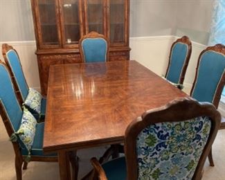 Dining room suite includes table, six chairs, two leaf inserts, and china cabinet