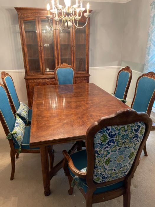 Dining room suite includes table, six chairs, two leaf inserts, and china cabinet