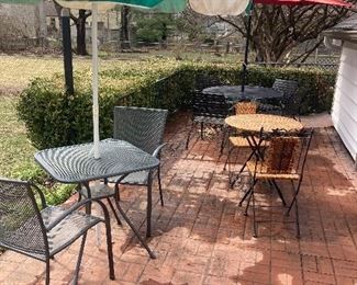 3 patio tables and chairs :wrought iron table w/4 chairs , wrought iron table & 2 chairs &
Iron and weave table & chair flat surfaces !umbrellas !