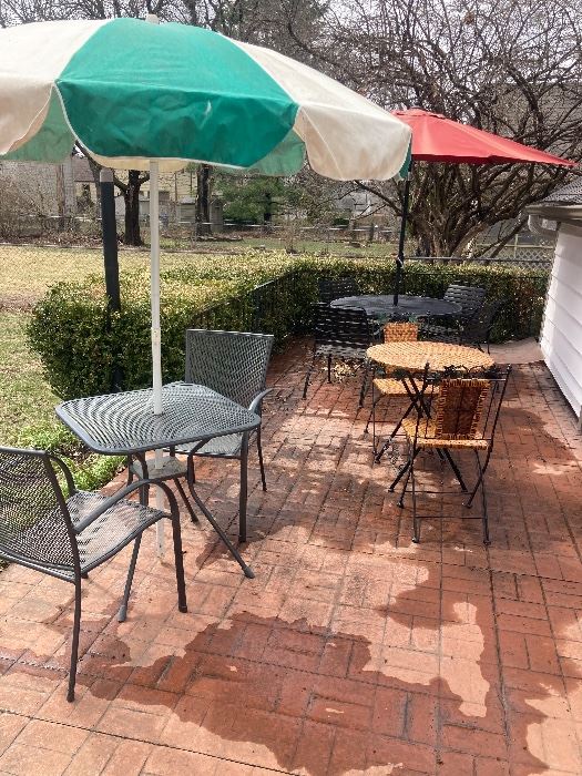 3 patio tables and chairs :wrought iron table w/4 chairs , wrought iron table & 2 chairs &
Iron and weave table & chair flat surfaces !umbrellas !