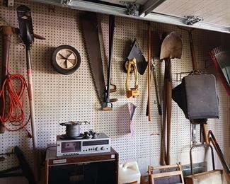 Garden tools shovels rakes two man saw