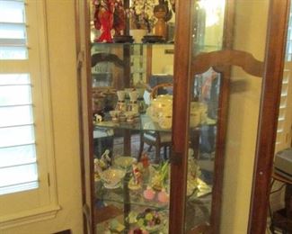 Corner cabinet with assorted collectibles