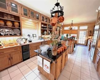 HUGE kitchen packed with everything from antique copper and olive jars to vintage Fitz & Floyd.  So much color!  So much fun!