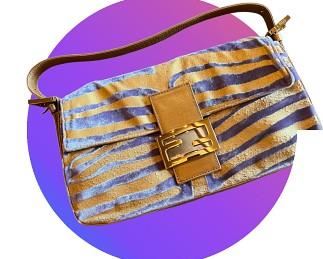 This is a FENDI classic!  Purple and gold zebra baguette.  Baguettes and the hottest handbag right now and you can’t find this one…ever!  Gotta love the world of Estate Sales!