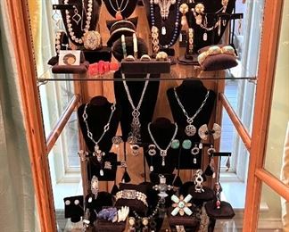 Fine jewelry, 18k, 14k, sterling.  Necklaces, earrings, bracelets, bangles, rings.  You will LOVE this case located in the living room.
