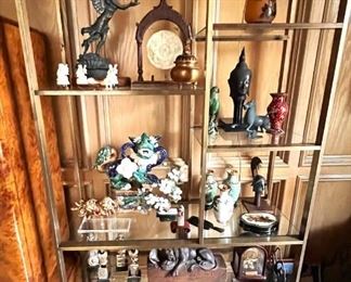 Pair of stunning dark brass etageres filled with collections from around the world!