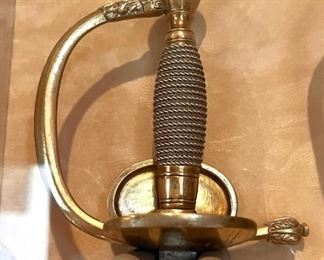 Antique sword with hinged grip