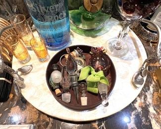 Vintage wine stoppers, shot glasses, unopened Silver Rock Seltzer Water decanter, fish scale tray with handles