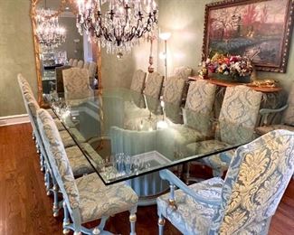 Custom glass topped dining table with 14 chairs