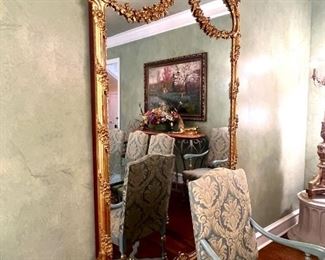 Monumental antique gilt mirror with floral swags