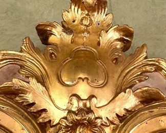 Carving detail on top of very large French mirror in Dining room