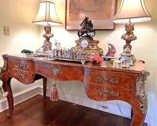 French desk with leather top, figural clock, lamps, sterling figural inwell