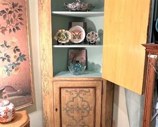 Interior of painted corner cabinet