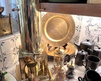 Antique brass coffee or hot water urn, gold chargers