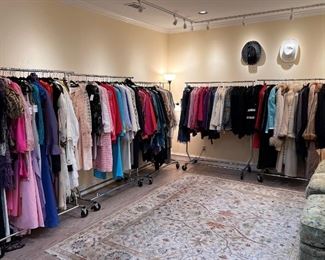 This is the tip of the iceberg in the clothing room.  We have 12 racks and closets full of designer clothing.  All clothing is located upstairs.  