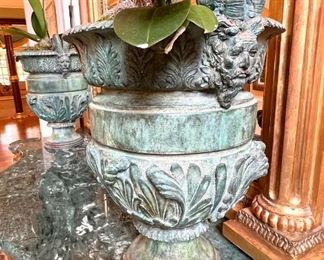 Pair of heavy bronze planters with ram’s head details