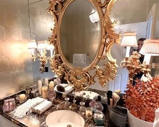 Ornate French oval gilt mirror