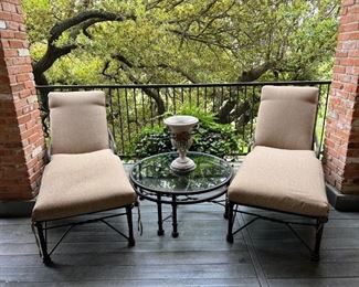 Pair of chaise lounges and round table