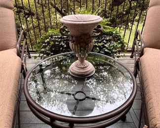 Heavy round iron coffee table and stone urn planter