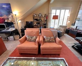 Pair of orange upholstered club chairs in upstairs office
