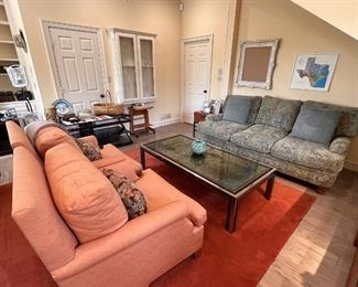 Sofa (one of a pair), orange club chairs and MCM 1972 Romeo Rega acid etched coffee table