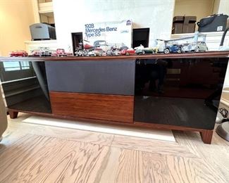 Contemporary console for sound system.  Very well made and the wood is beautiful