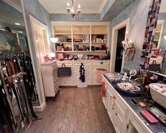 Very large “Hers” bathroom.  Belts, clothing, shoes, scarves, furniture, accessories