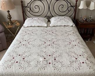 Beautiful queen comforter on a full size bed