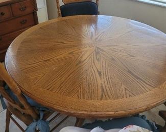 Very nice, round, wooden table with four chairs