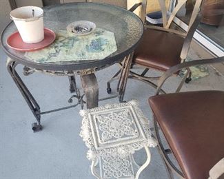The patio table and the other two chairs
