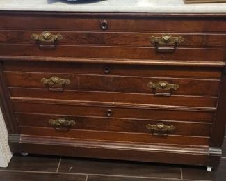Another small chest of drawers