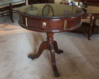 Beautiful drum table with brass feet 
On rollers