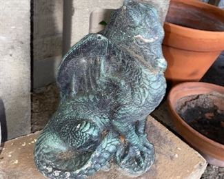This little concrete dragon can breath some for into your garden