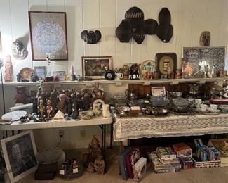 There are a few more figurines in this photo, a version of the Aztec calendar framed on the wall, and a selection of the kitchen items.  