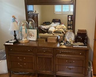 This dresser comes with the mirror, but if you want the Mary statue, that'll be a bit extra.