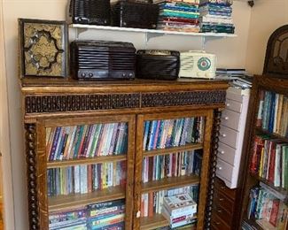 Absolutely stunning Oak book case with intricate detail. 1891 ornate bible, antique tube radios (True Tone, Zenith, Spartan, Emerson, Philco)