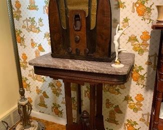 Philco tube radio in excellent condition, art deco figure, Victorian marble top mahogany table