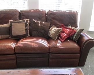 Reclines at end pillows which is a foot rest.