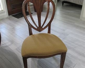 Sheild back chairs 10 total for beautiful inlay drop leaf round dining table has a custom round glass.