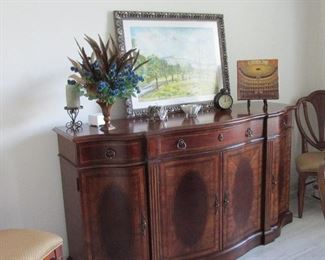 Hepplewhite buffet with round Mahogany oval motif & doors and drawers.