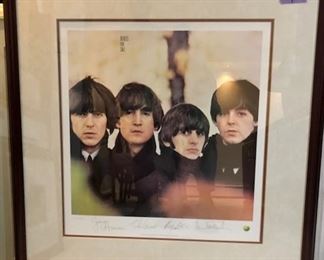 The signatures on this print are authentic, there is a certificate of authenticity on the back.  These signatures were signed by the Beatles on a plate.