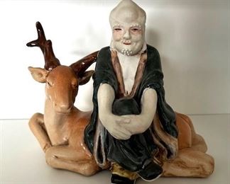 Kinder Harris man with deer ceramic figurine